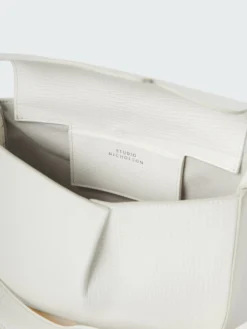 Studio Nicholson Fortuna Leather Bag In Parchment 13 Studio Nicholson Fortuna Leather Bag In Parchment -Studio Nicholson FORTUNASN 743PALMELLATOLEATHERIVORY 411 a26748c0 6ebf 4f4f a5eb 9280964951a9 scaled