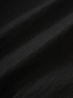 Studio Nicholson Tiller Short In Black 19 Studio Nicholson Tiller Short In Black -Studio Nicholson TILLERSNM 1142SPORTBOTTONBLACK 0075 scaled